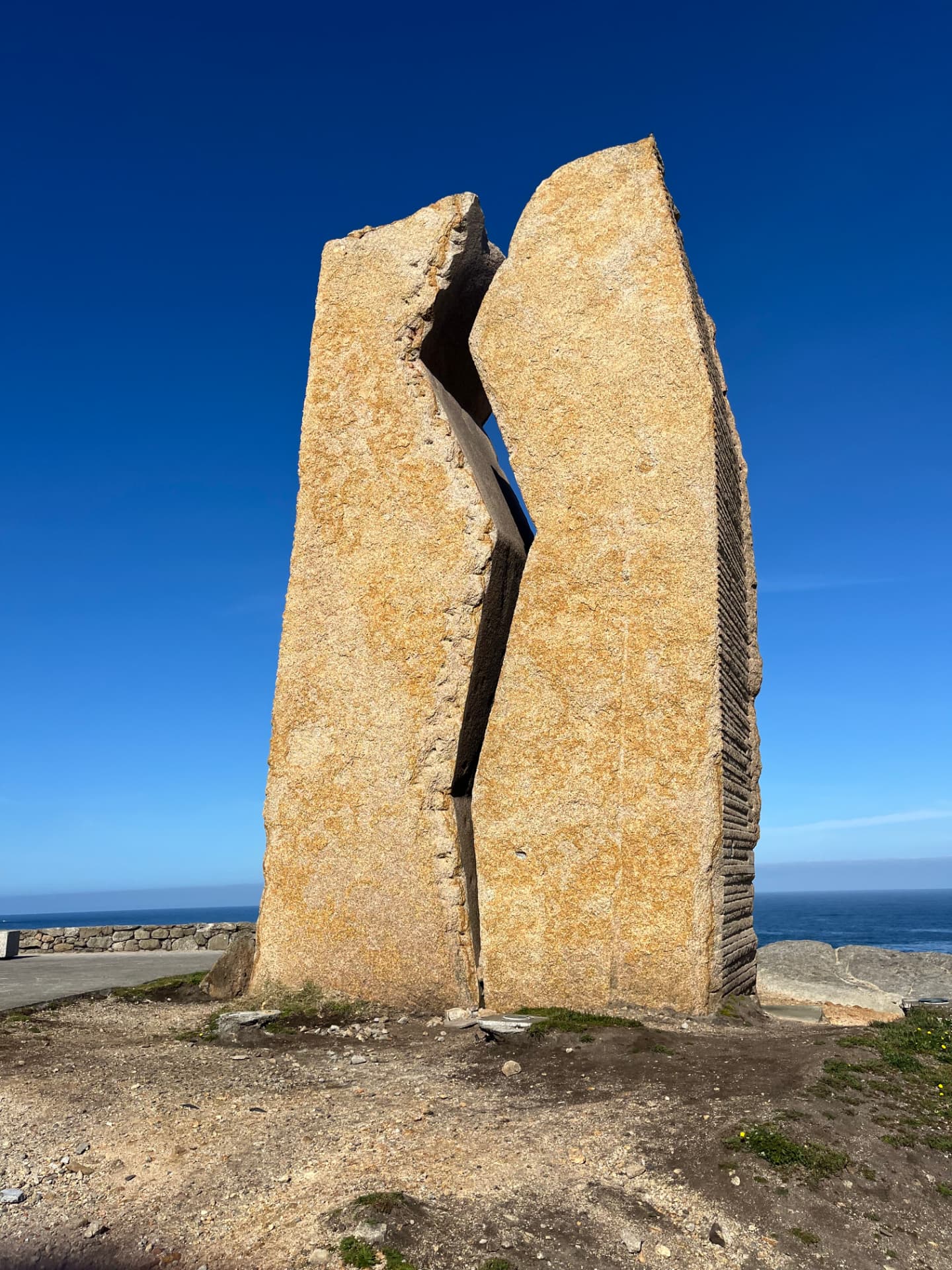 A split granite monolith by the sea